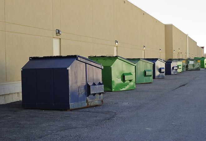 large construction waste containers in a row at a job site in Arp